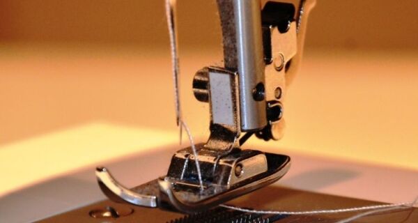 Threading needle on sewing machine